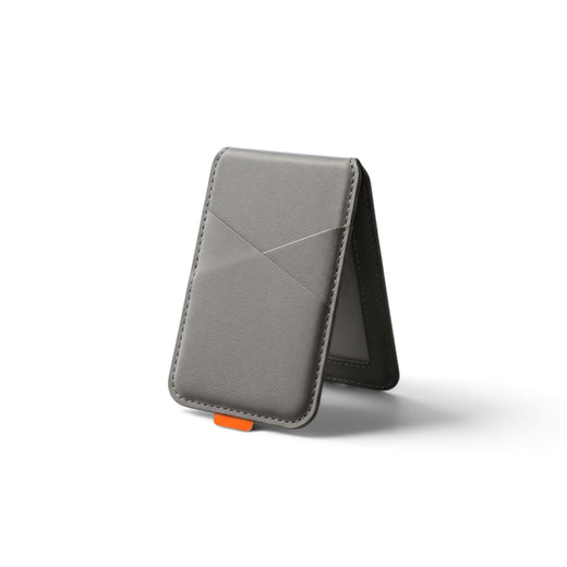 Sleek magnetic phone case with card holder for everyday use, featuring artificial leather texture and compact design.