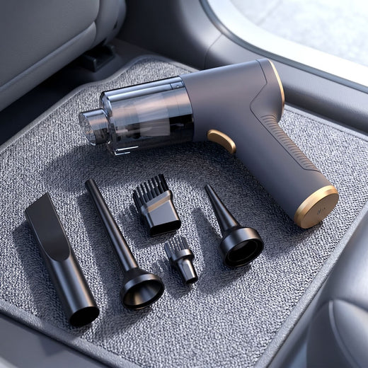 Portable handheld car vacuum resting on a textured fabric car mat with a car seat in the background in soft daylight.