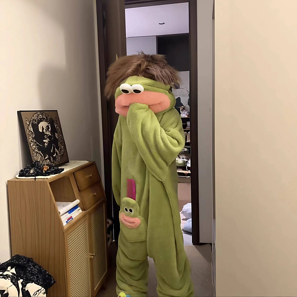 zero2cart green monster fleece onesie pajamas with a character hood and front pocket worn by a person indoors