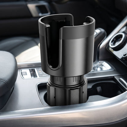 Close-up of an adjustable car cup holder extender inside a vehicle's cup holder, showing the smooth surface and anti-slip grip detail.