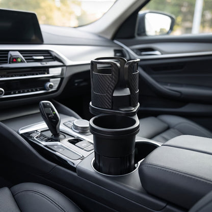 Close-up of a dual-compartment car cup holder with phone stand in a modern car interior, emphasizing its shape and rotating base.