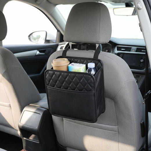 Unbranded car seat back organizer bag hanging from the back of a car seat, showcasing its simple design and storage pockets in a realistic vehicle interior.