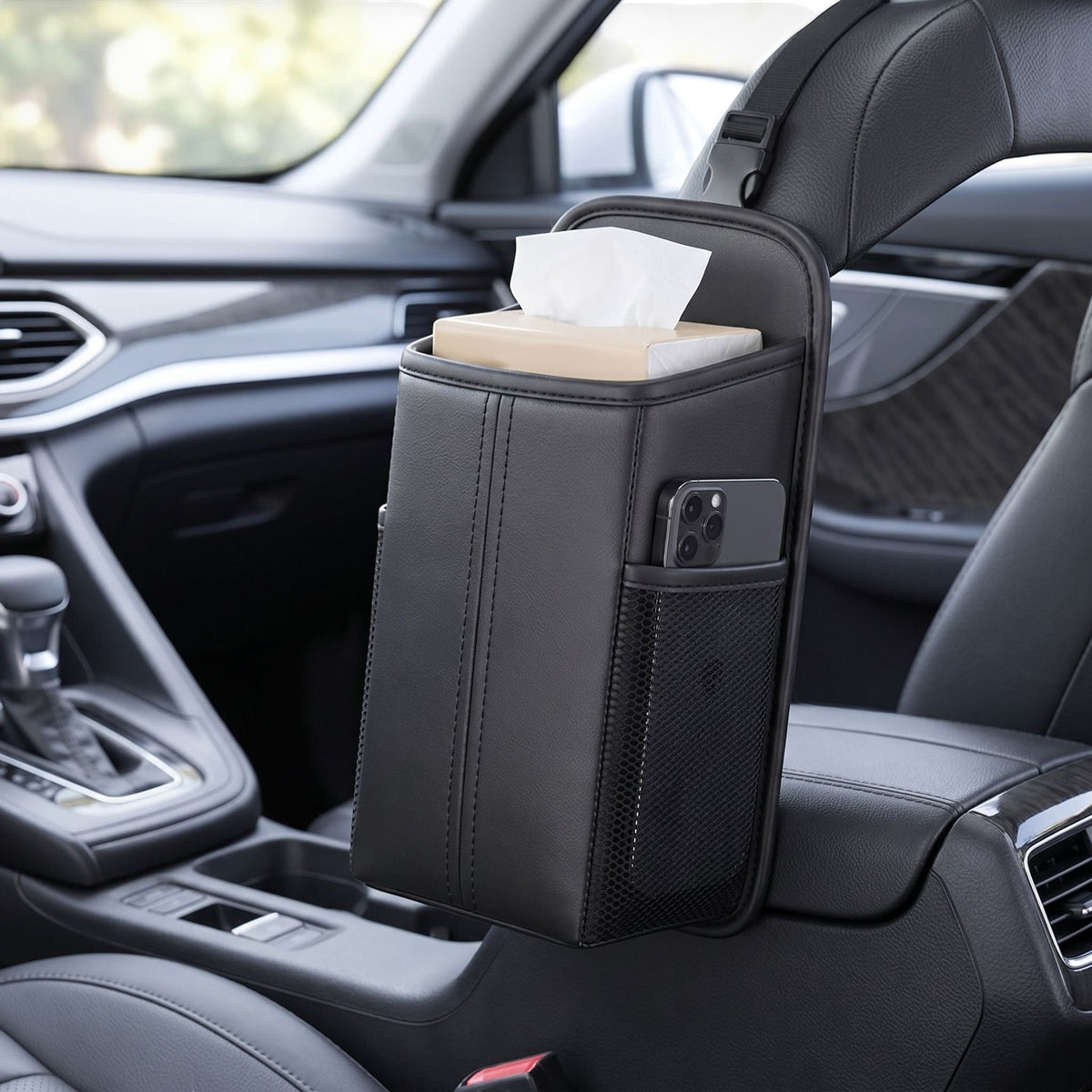 Close-up of a rectangular car seat organizer bag with PU leather finish and stitched edges, illuminated by natural daylight.