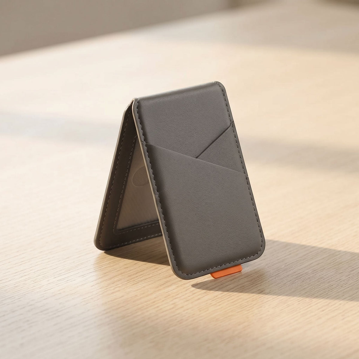 Close-up of magnetic phone case showing leather texture, RFID blocking card slot, and secure magnetic closure in natural light.