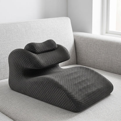 Detailed close-up of curved support pillow with textured cover and visible memory foam contours.