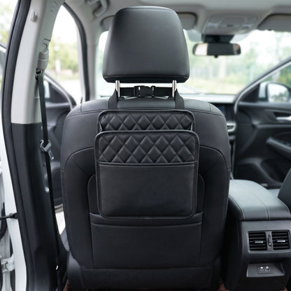 Detailed shot of a small unbranded car seat organizer highlighting textured fabric and stitching, with a blurred car interior background.