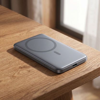 Close-up image of the slim magnetic power bank on a wooden surface, showcasing material details and craftsmanship.