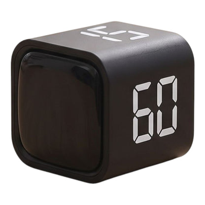 Close-up of a compact digital countdown timer on a wooden desk showing 3 hours, highlighting its simple design and clear display.