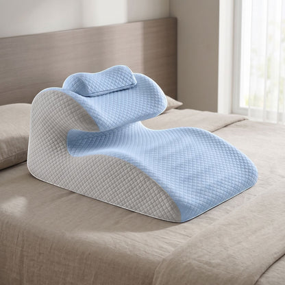 Supportive ergonomic cervical pillow placed on a modern bed, highlighting its contours and soft water-resistant cover.