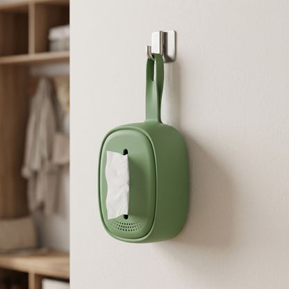 Side perspective of a tiny silicone tissue holder attached inside a home or office, showing its flexibility and everyday practicality.