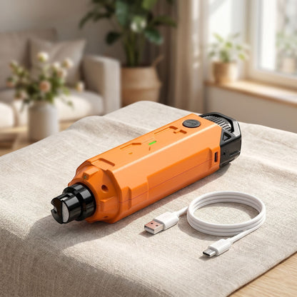 Small dog nail grinder placed on light-colored fabric near a window, illustrating easy pet nail grooming in a cozy home environment.