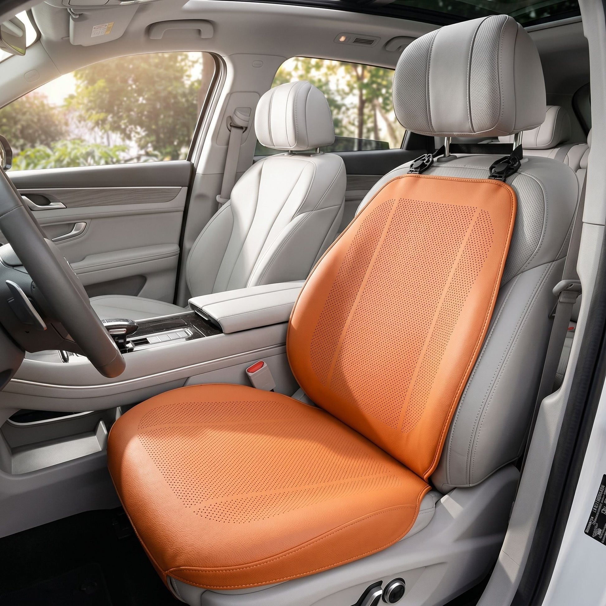 Lifestyle scene inside a well-lit vehicle with sunlight, featuring a front seat with a ventilated cushion, emphasizing practicality and daily use.