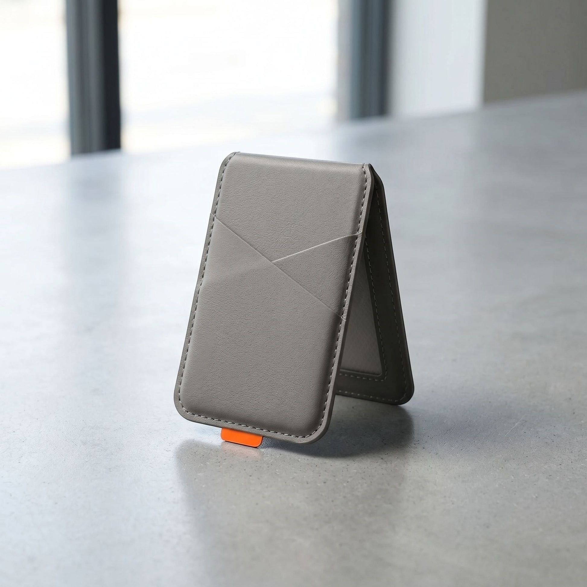 Sleek magnetic phone case with card holder for everyday use, featuring artificial leather texture and compact design.