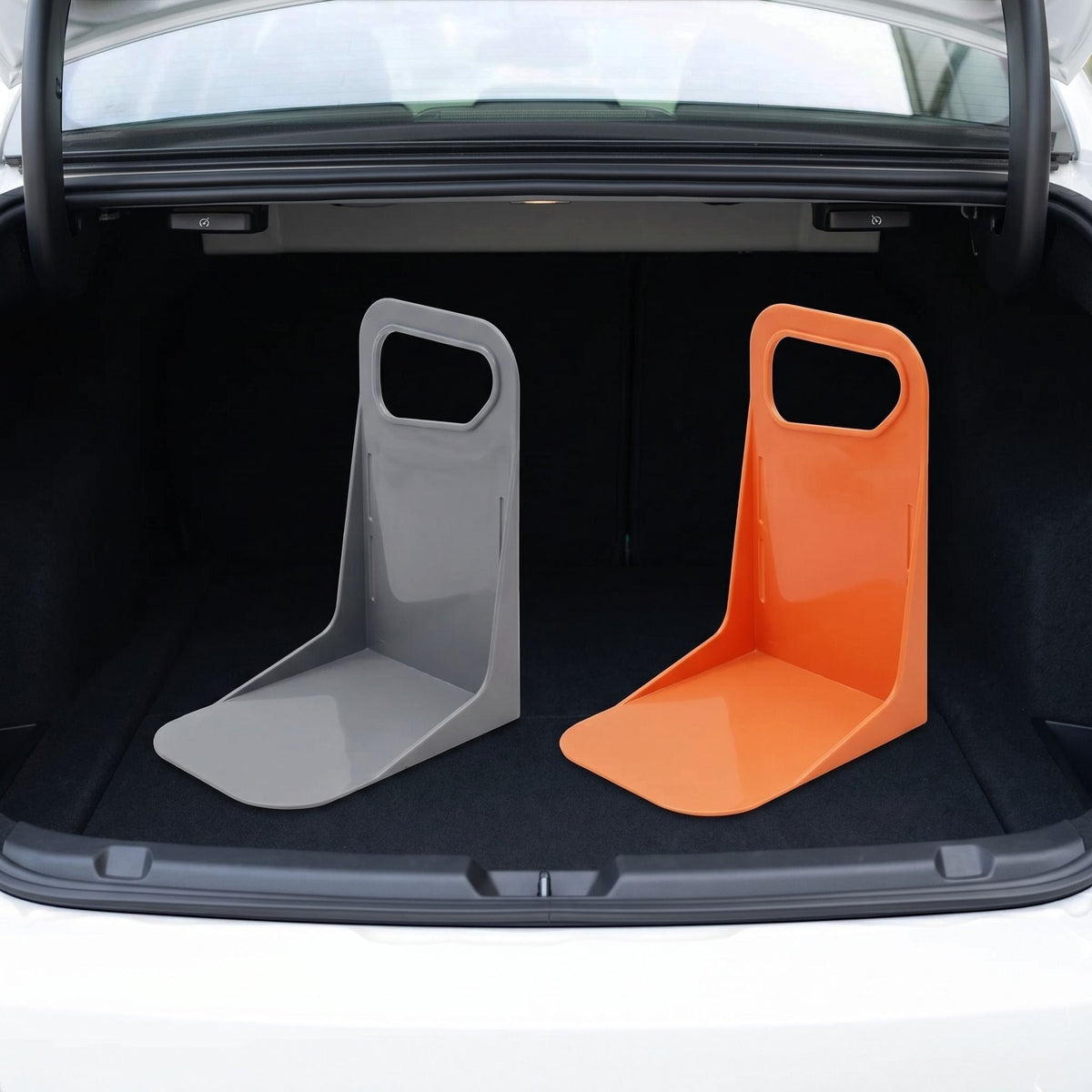 Centered view of a small, unbranded plastic car trunk organizer with anti-slip bottom in a tidy car trunk environment.