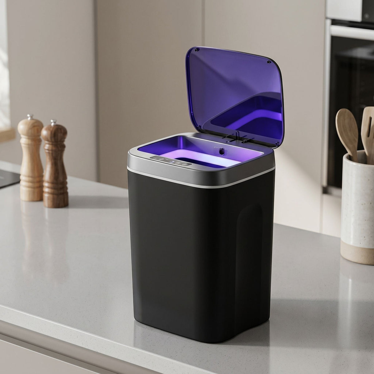 Unbranded 16L automatic sensor trash can on modern kitchen countertop with natural daylight.