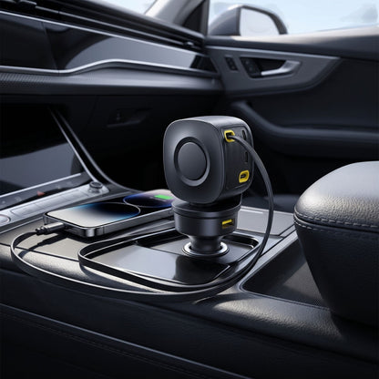 Minimalist 100W retractable car charger in a modern vehicle, centered in the lighter socket with extended cable and natural lighting.