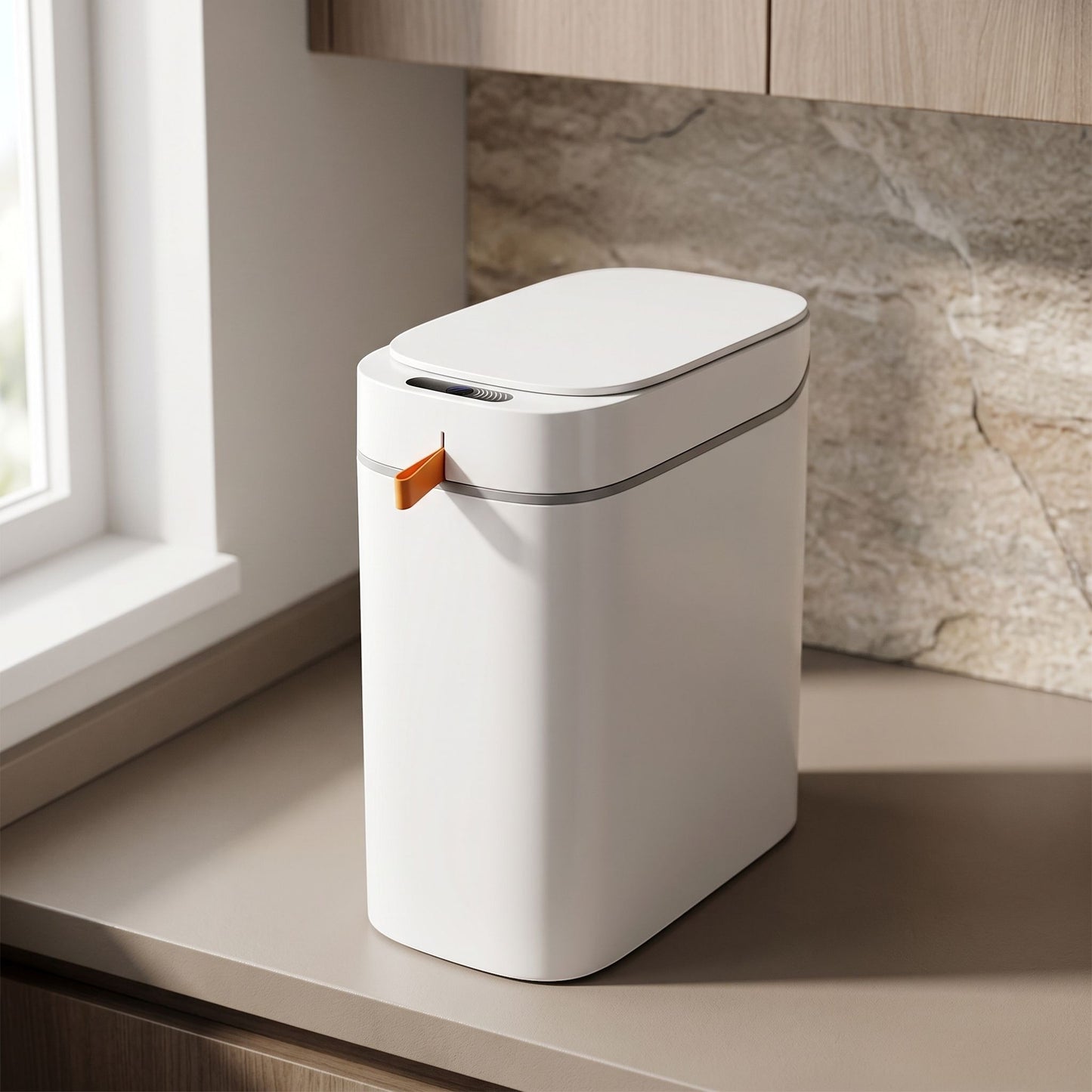 Rectangular rechargeable sensor trash can in a modern kitchen with natural light, showcasing its smooth surface and sensor area.