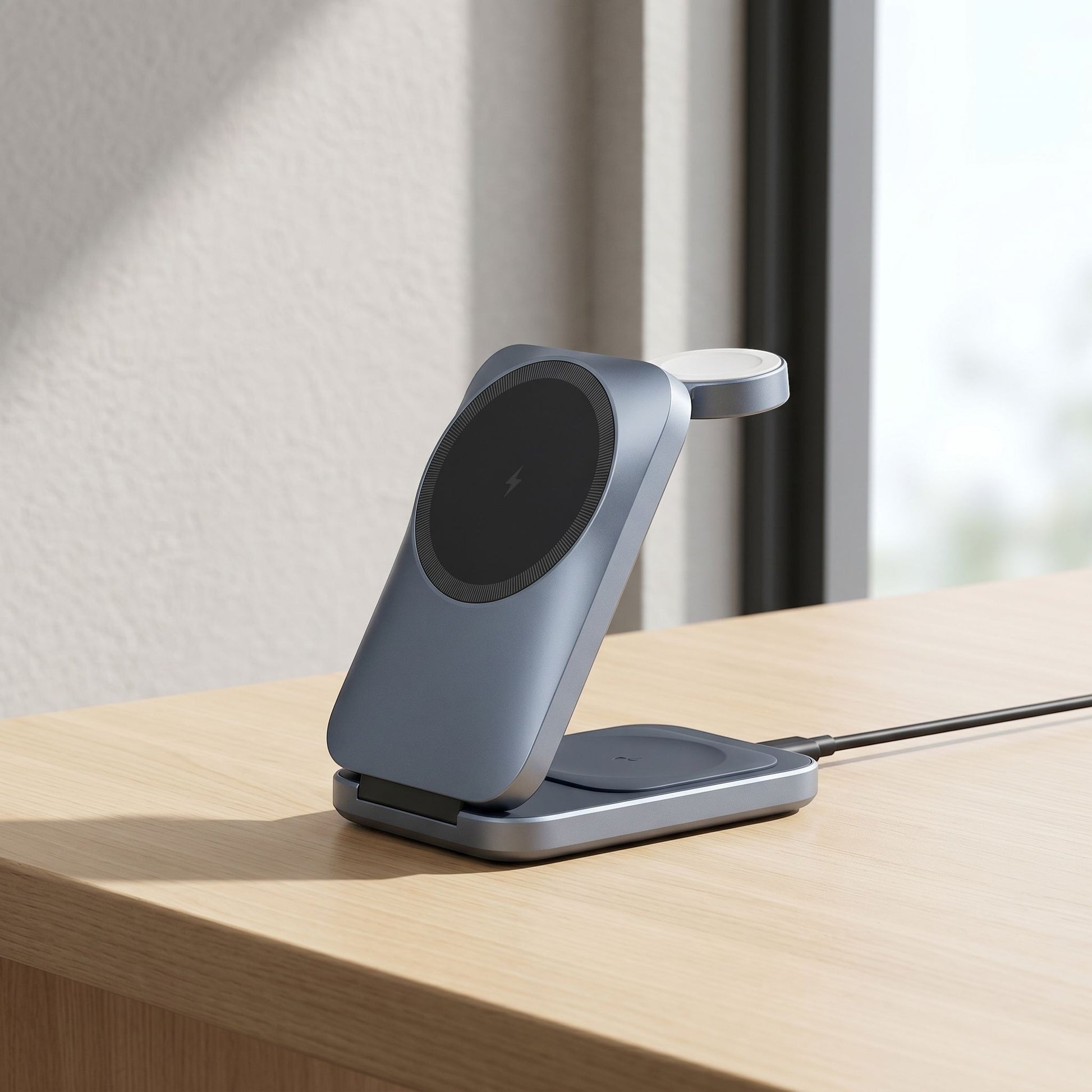 Foldable 3-in-1 wireless charging station on a sleek desk, showing phone, watch, and earbuds charging in natural light.