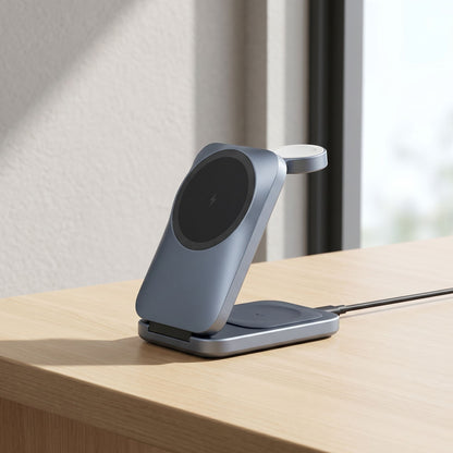 Foldable 3-in-1 wireless charging station on a sleek desk, showing phone, watch, and earbuds charging in natural light.