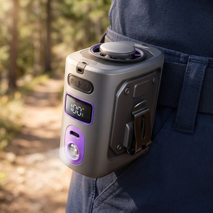 Lifestyle scene with a portable clip fan clipped to a hiking waistband, illuminated by sunlight to emphasize its sleek shape and details.