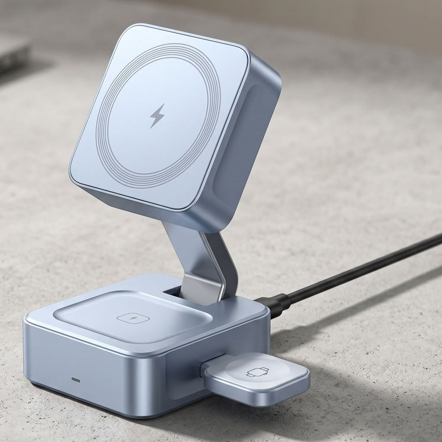 Studio image of foldable magnetic wireless charger stand displaying charging sections with natural lighting.