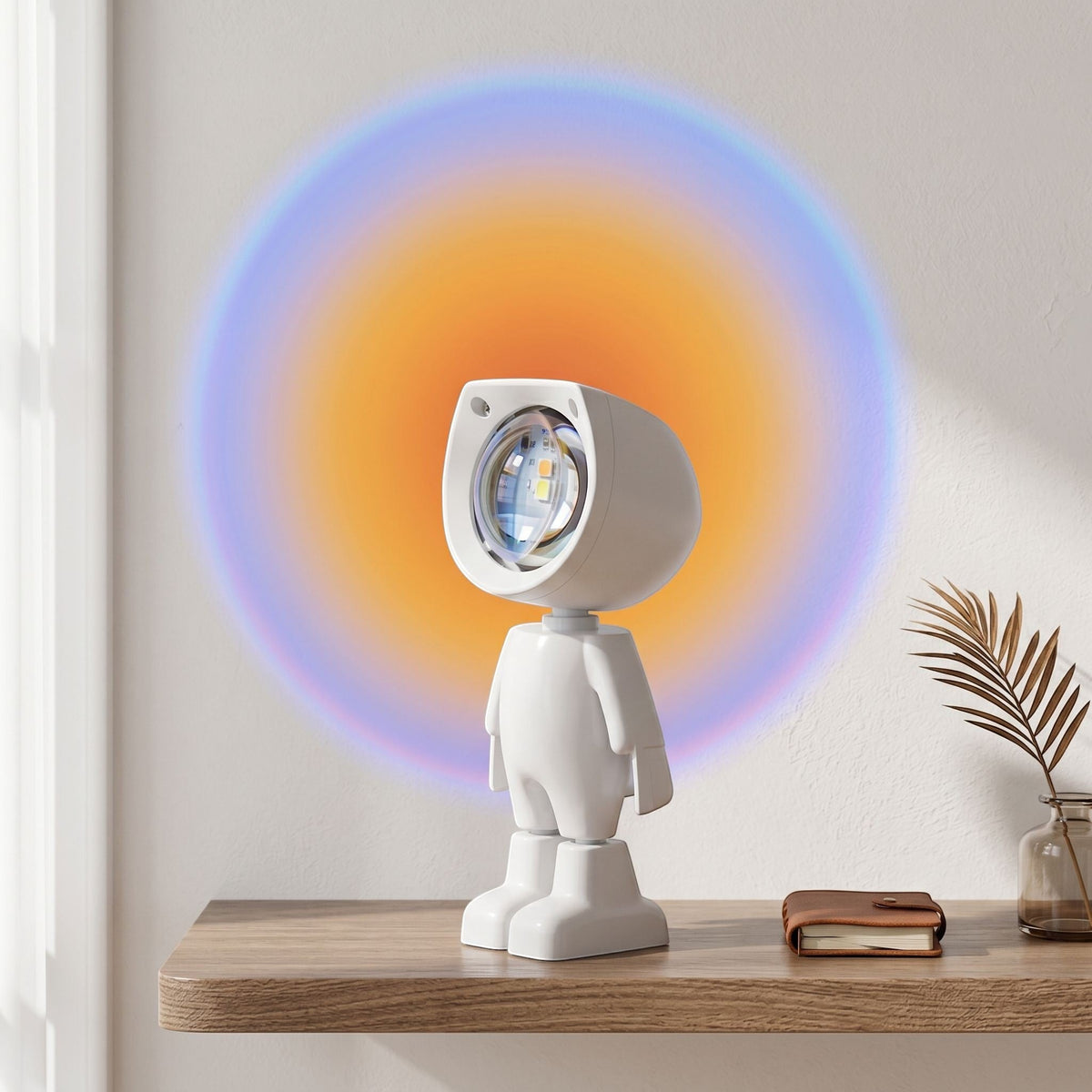 zero2cart astronaut projection night light casting a colorful sunset rainbow glow on a white wall on a wooden desk