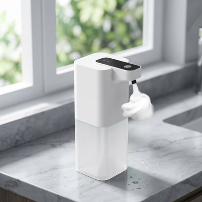 zero2cart white automatic touchless soap dispenser dispensing foam on a marble kitchen countertop