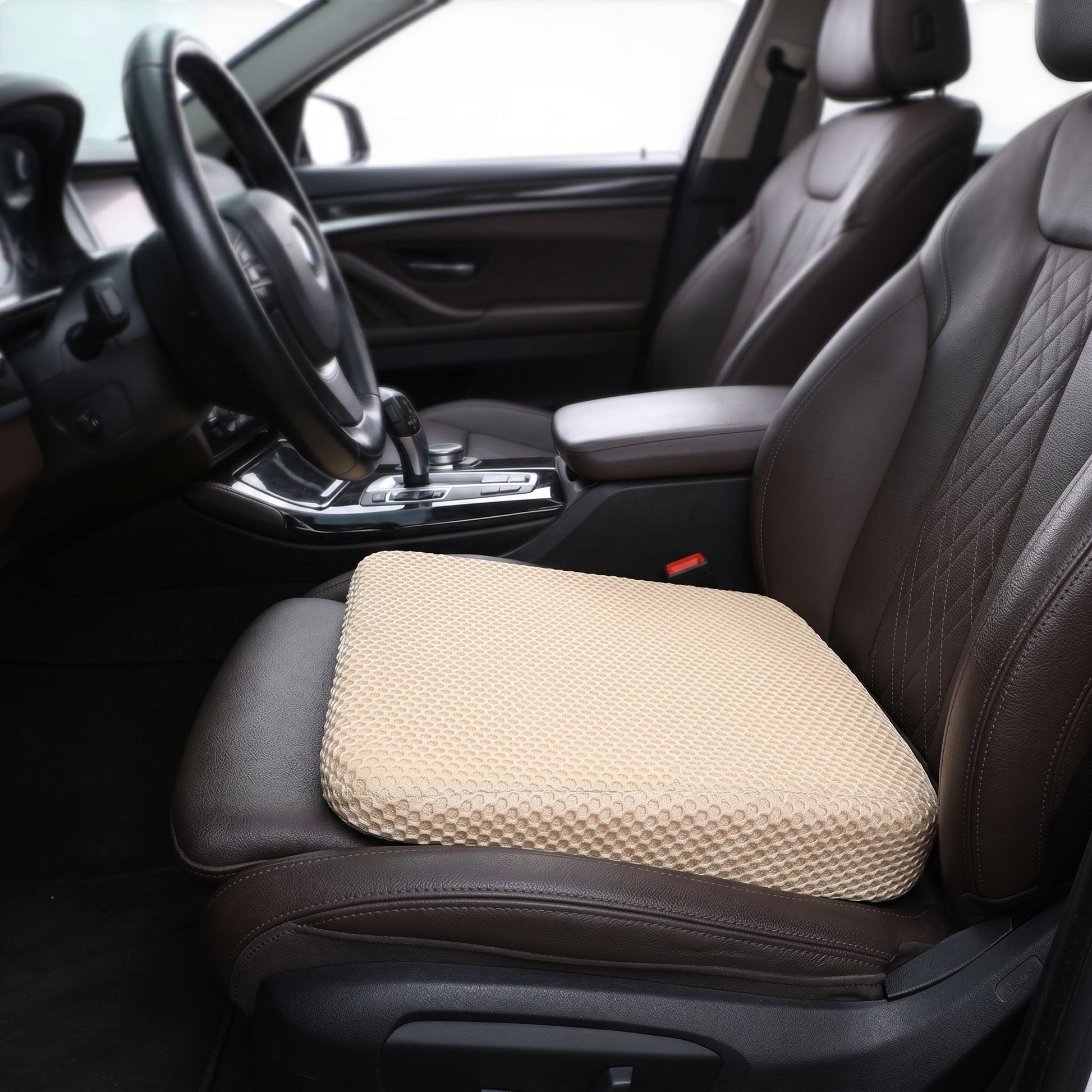 zero2cart beige honeycomb car seat booster cushion with breathable 3D mesh surface placed on a leather vehicle seat