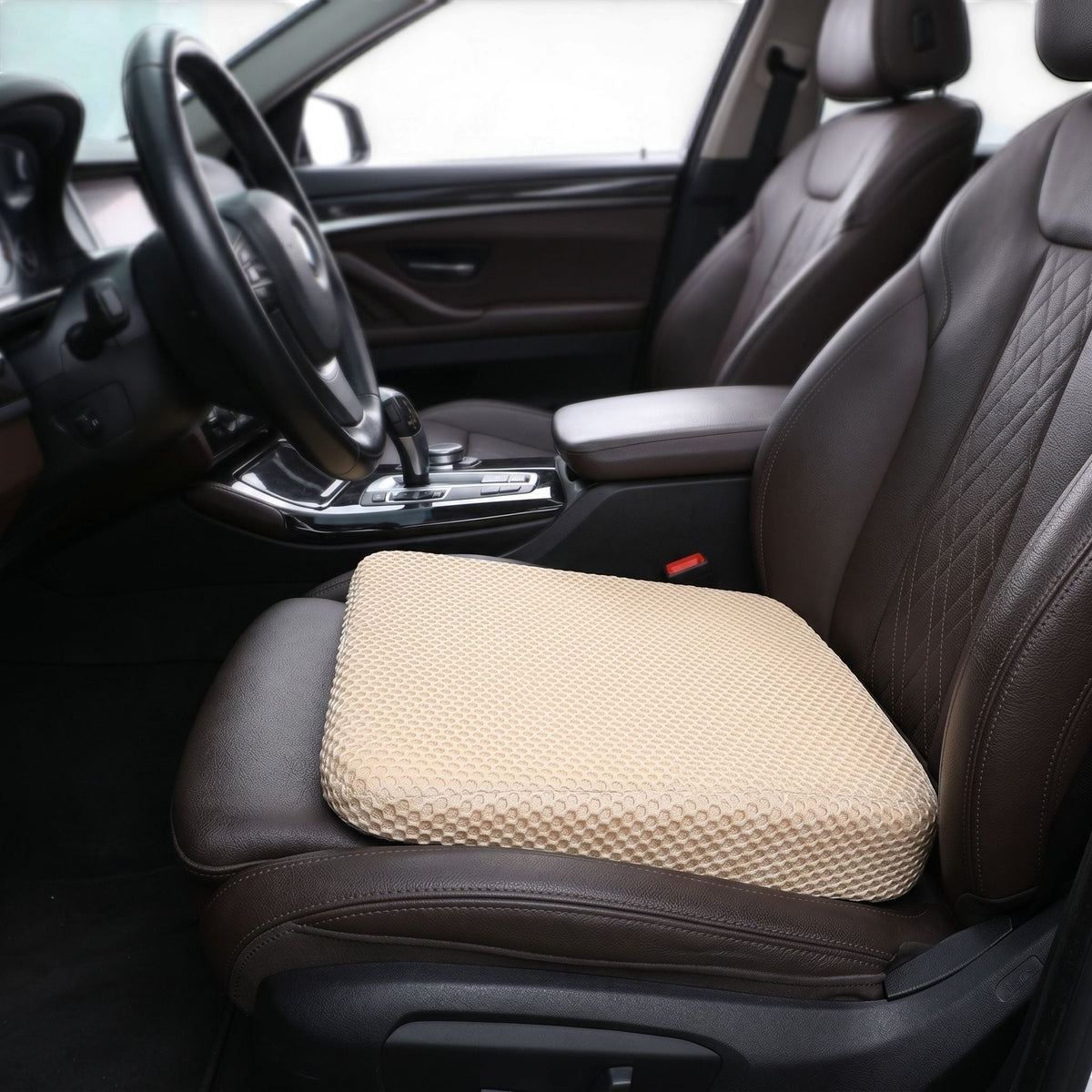zero2cart beige honeycomb car seat booster cushion with breathable 3D mesh surface placed on a leather vehicle seat