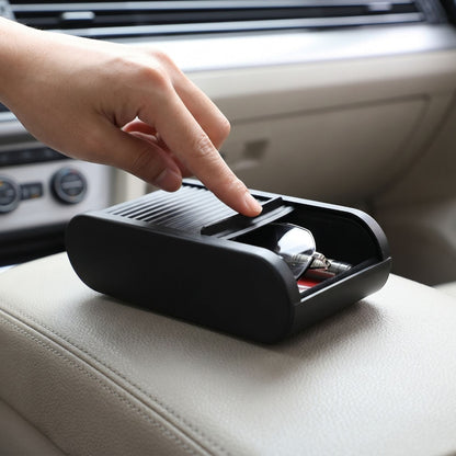 zero2cart black telescopic car center console organizer box with a sliding lid holding glasses on a car armrest