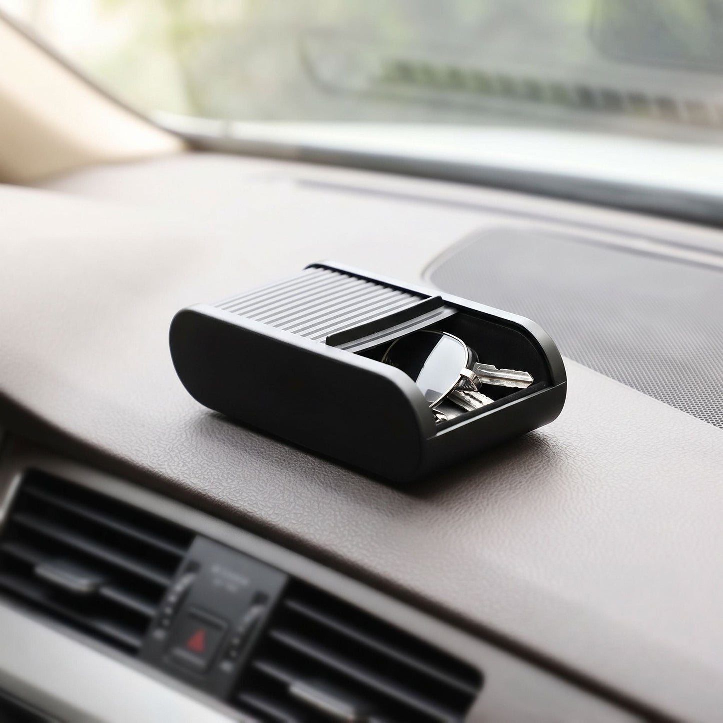 zero2cart black telescopic car dashboard storage box holding keys and glasses on a vehicle console