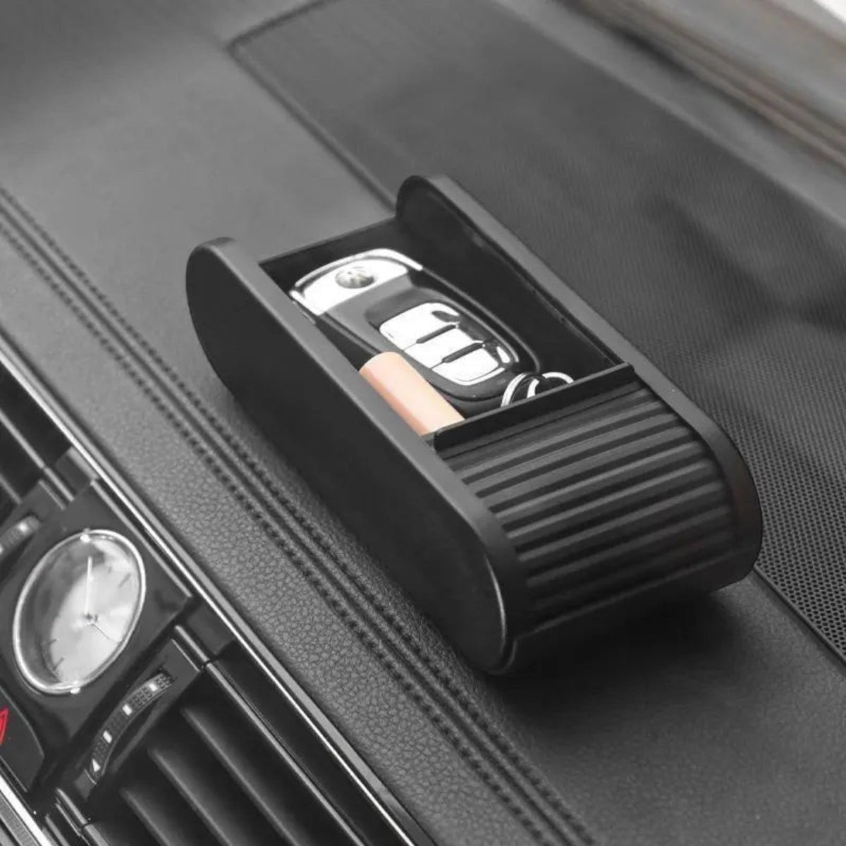zero2cart black telescopic car dashboard storage box holding keys and coins on a vehicle console