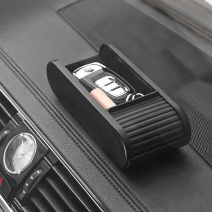 zero2cart black telescopic car dashboard storage box holding keys and coins on a vehicle console