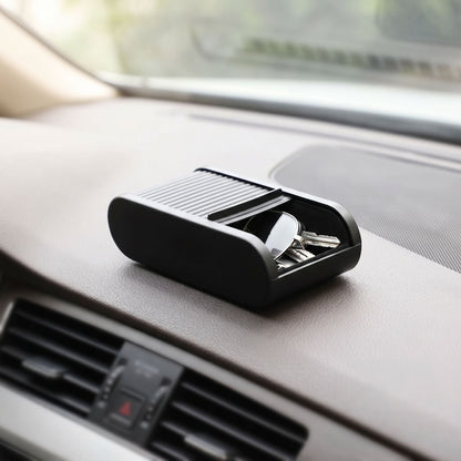 zero2cart black telescopic car dashboard storage box holding keys and glasses on a vehicle console