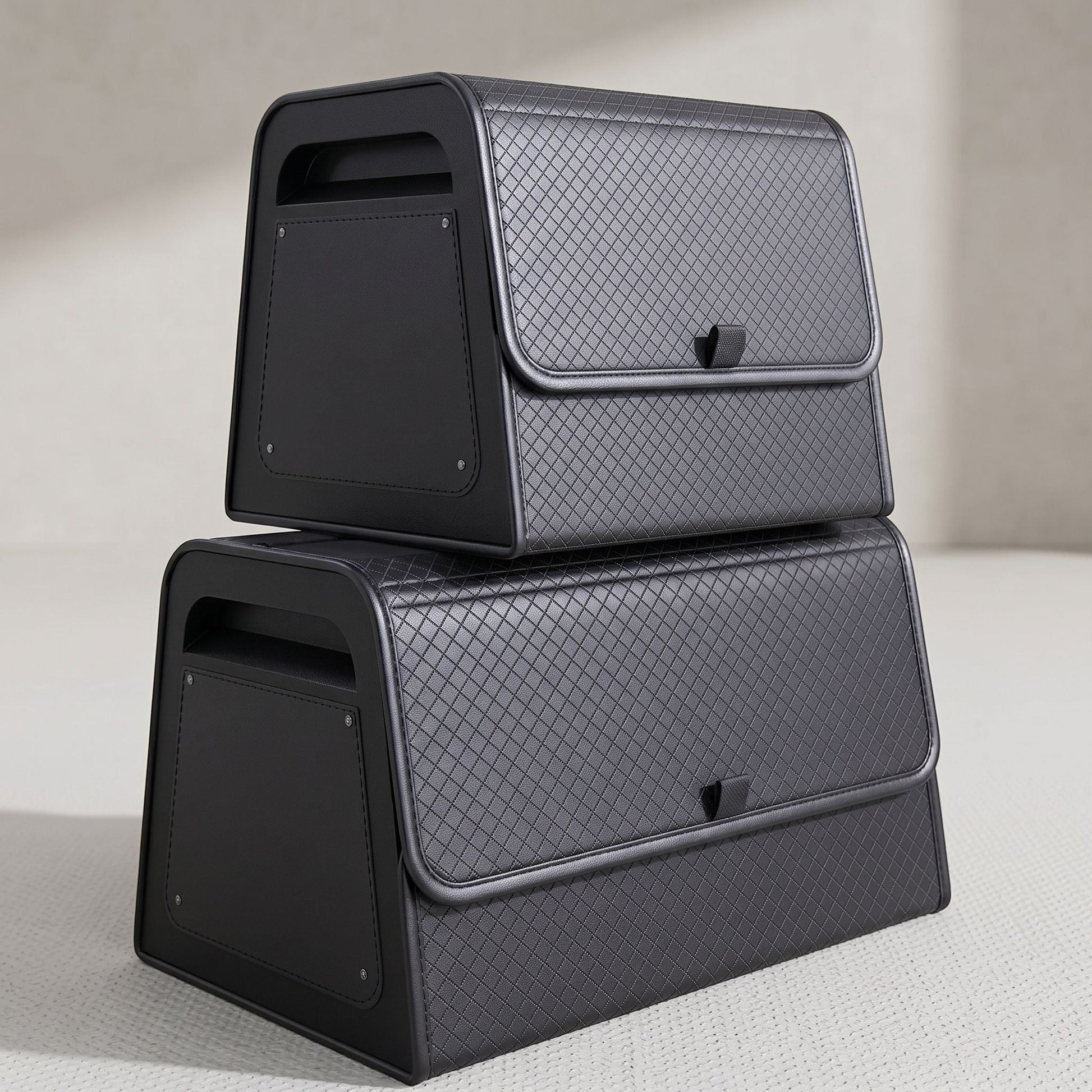zero2cart black PU leather magnetic car trunk organizers in two sizes stacked on a light surface