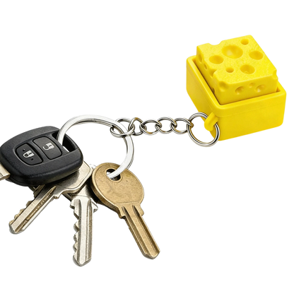zero2cart yellow cheese-shaped fidget clicker keychain attached to a metal keyring with house and car keys