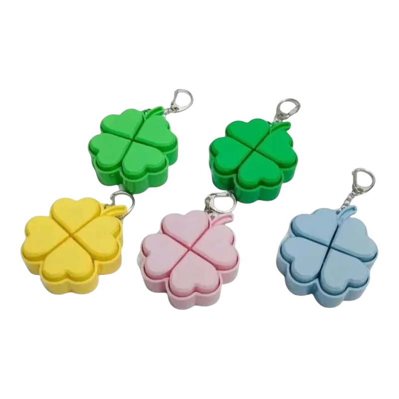 zero2cart four-leaf clover light-up pop it fidget keychains in green, yellow, pink, and blue silicone