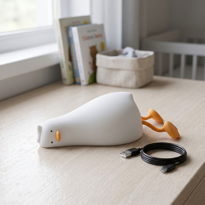 zero2cart rechargeable duck night light in soft white silicone with orange feet on a wooden nursery desk