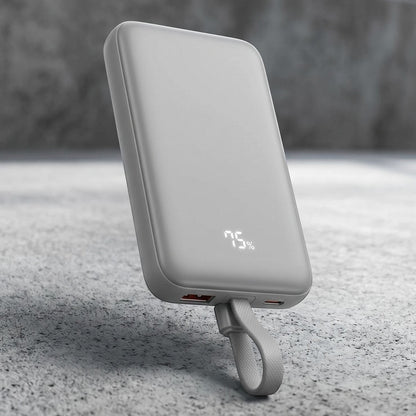zero2cart 10000mAh magnetic wireless power bank in gray with a digital battery display and integrated carry loop.