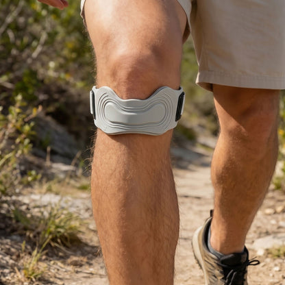 zero2cart gray adjustable patellar tendon support strap worn on a knee during an outdoor hike