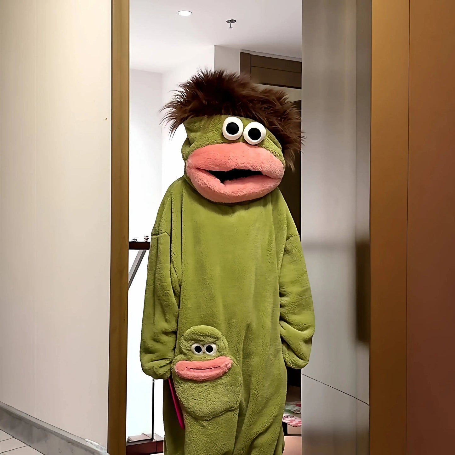 zero2cart green monster fleece onesie pajamas with a brown faux fur mane and a small character pocket