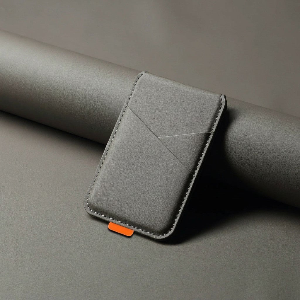 zero2cart grey magnetic artificial leather phone card holder with a small orange pull tab on a matching grey surface