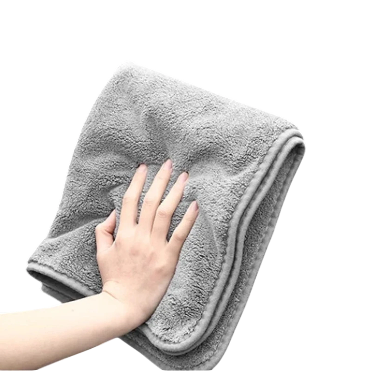 zero2cart grey microfiber car drying towel with a soft, plush texture held by a hand against a black background