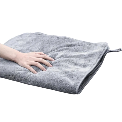 zero2cart grey microfiber car drying towel with soft plush texture being pressed by a hand