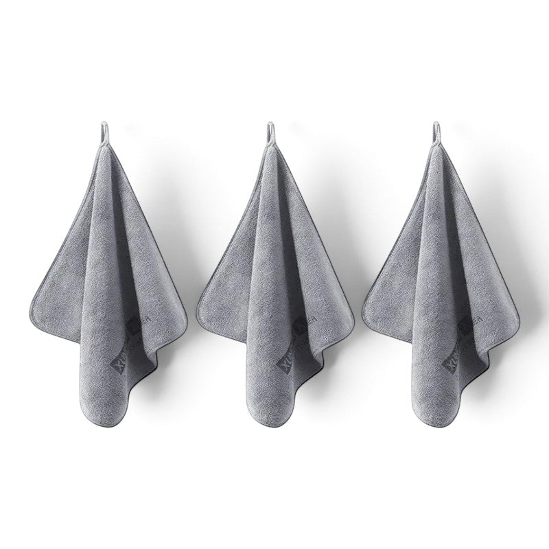 Three grey zero2cart microfiber towels hanging on hooks for car drying, cleaning, and daily multifunctional use.