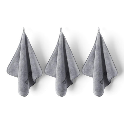 Three grey zero2cart microfiber towels hanging on hooks for car drying, cleaning, and daily multifunctional use.