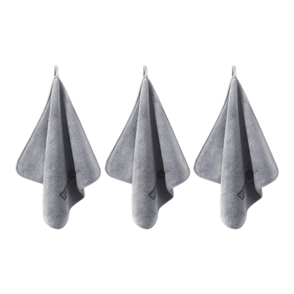 Three grey zero2cart microfiber towels hanging on hooks for car drying, cleaning, and daily multifunctional use.