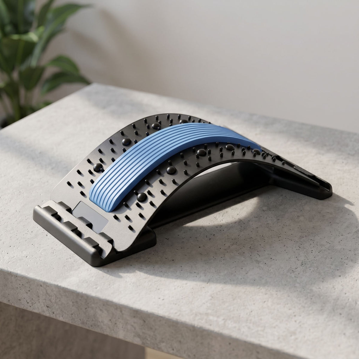 zero2cart black and blue lumbar back stretching support tool with massage nodes on a grey surface