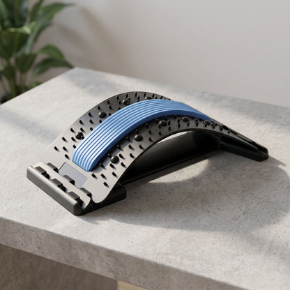 zero2cart black and blue lumbar back stretching support tool with massage nodes on a grey surface