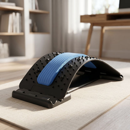 zero2cart lumbar back stretching support with blue cushioned center and black acupressure nodes on a home floor